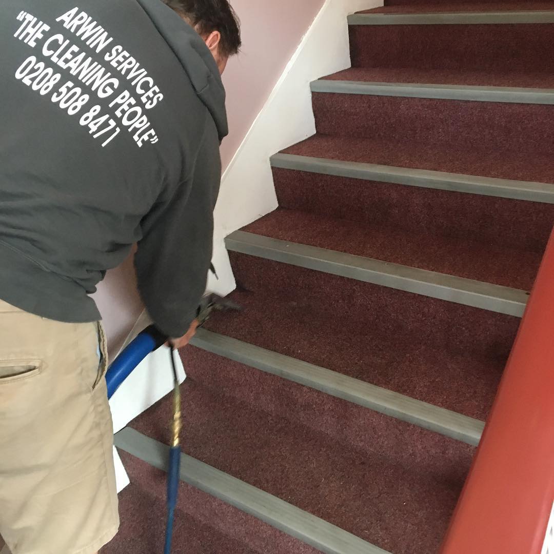 Arwin Cleaning Services team professionally cleaning hotel stairs